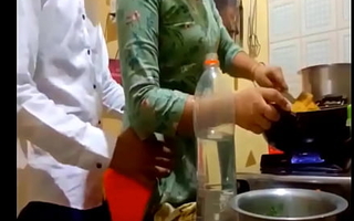indian new betrothed couple romance in kitchen
