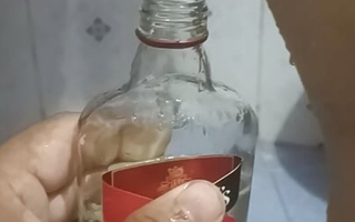 Bhabi pissing in unpaired bottle