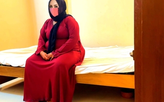 Gender a Chubby Muslim mother-in-law wearing a red burqa & Hijab